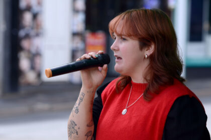 Charlotte White performing at New Street Corner on Honiton Market Charter Day 2025