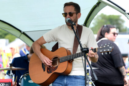 Red Stitches playing on Allhallows Playing Field at Honiton Market Charter Day 2025