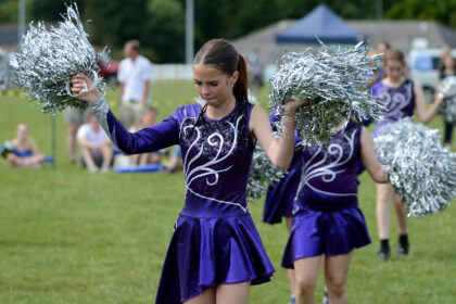 Twirlstars Majorettes performing on Allhallows Field at Honiton Market Charter Day 2025